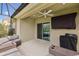Relaxing covered patio with ample seating, outdoor fan, and sliding door to inside at 4833 San Palermo Dr, Bradenton, FL 34208