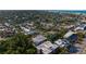 Expansive aerial view showcasing the property surrounded by lush landscapes and a network of canals at 5026 Calle Minorga, Sarasota, FL 34242