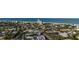 Breathtaking aerial shot of a coastal town with buildings and vegetation near the ocean shoreline at 5026 Calle Minorga, Sarasota, FL 34242
