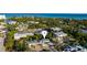 Stunning aerial view of property surrounded by lush greenery, highlighting its prime location near the ocean at 5026 Calle Minorga, Sarasota, FL 34242