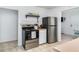 Functional kitchen with stainless steel refrigerator and dark range at 5026 Calle Minorga, Sarasota, FL 34242