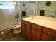 Bathroom showcasing a tile shower and a vanity sink with a mirror at 5353 Shadow Lawn Dr, Sarasota, FL 34242