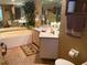 Bathroom with a soaking tub, vanity, and tiled flooring at 5353 Shadow Lawn Dr, Sarasota, FL 34242