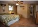 Bedroom featuring tile floors, natural light, and closet at 5353 Shadow Lawn Dr, Sarasota, FL 34242