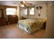 Comfortable bedroom featuring tile floors, natural light, and furnishings at 5353 Shadow Lawn Dr, Sarasota, FL 34242