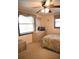 Cozy bedroom featuring a comfortable bed and a dresser with a mirror at 5353 Shadow Lawn Dr, Sarasota, FL 34242