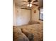 Bedroom with a ceiling fan and a closet with plenty of storage space at 5353 Shadow Lawn Dr, Sarasota, FL 34242