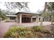 Charming home with a brick drive, covered parking, and well-maintained landscaping at 5353 Shadow Lawn Dr, Sarasota, FL 34242