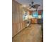 Well-lit kitchen featuring light wood cabinets, tile floors, modern appliances, and a pleasant window view at 5353 Shadow Lawn Dr, Sarasota, FL 34242