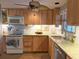Bright kitchen with light wood cabinets, modern appliances, and granite countertops at 5353 Shadow Lawn Dr, Sarasota, FL 34242