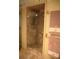 Bathroom showcasing a glass-enclosed shower with stone-look tiles at 5353 Shadow Lawn Dr, Sarasota, FL 34242