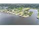 An aerial view highlights the waterfront community park, canal access, and nearby residential area at 5403 Fleming St, Port Charlotte, FL 33981