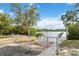 Gated boat ramp with signage alerts users to close and lock gates leading to waterfront at 5403 Fleming St, Port Charlotte, FL 33981