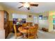 Traditional dining room with wood table and chairs, blinds, and neutral carpet at 5403 Fleming St, Port Charlotte, FL 33981