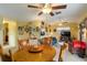 Spacious living room and dining room combo with ceiling fans and plenty of natural light at 5403 Fleming St, Port Charlotte, FL 33981
