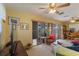 A light-filled living room with large windows, cozy seating, and open floor plan at 5403 Fleming St, Port Charlotte, FL 33981