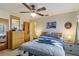 Relaxing main bedroom featuring a ceiling fan and natural light at 5403 Fleming St, Port Charlotte, FL 33981
