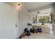 Enclosed porch with a bathtub, tile floors and entry door at 5403 Fleming St, Port Charlotte, FL 33981