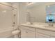 Well-lit bathroom with dual sinks, a tub-shower combination, and a neutral color scheme at 5475 Summit Gln, Bradenton, FL 34203