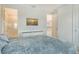 Bright bedroom featuring a comfortable bed, modern dresser, and an en-suite bathroom for added convenience at 5475 Summit Gln, Bradenton, FL 34203