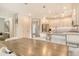 Open-concept kitchen with stainless steel appliances and island with bar seating at 5475 Summit Gln, Bradenton, FL 34203