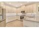 Well-lit kitchen with stainless steel appliances, white cabinetry, and a clean, modern design at 5475 Summit Gln, Bradenton, FL 34203