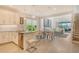 Open-concept kitchen with modern appliances, stylish countertops, and an adjacent dining area at 5475 Summit Gln, Bradenton, FL 34203