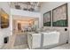 Open floor plan with a modern living room, an adjacent dining area and kitchen, and soaring ceilings at 5475 Summit Gln, Bradenton, FL 34203