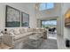 Spacious living room with sectional sofa and a view of the screened in patio at 5475 Summit Gln, Bradenton, FL 34203