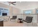 Inviting loft space featuring comfortable chairs, a modern desk, and stylish decor at 5475 Summit Gln, Bradenton, FL 34203