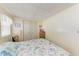 Bedroom with closet, marine life themed bedding, and natural light from window at 5619 Bayshore Rd # 203, Palmetto, FL 34221