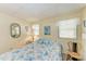 Bedroom with marine life themed bedding, natural light and accent furniture at 5619 Bayshore Rd # 203, Palmetto, FL 34221