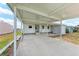 Spacious covered carport and entryway leading to the home's front door at 5619 Bayshore Rd # 203, Palmetto, FL 34221