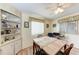 Dining area has a wooden table with seating for four, built-in shelving, and bright natural light at 5619 Bayshore Rd # 203, Palmetto, FL 34221