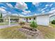 Charming single-story home featuring a covered carport and a well-maintained front yard at 5619 Bayshore Rd # 203, Palmetto, FL 34221