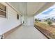 Covered patio offering ample space and a view of the surrounding community at 5619 Bayshore Rd # 203, Palmetto, FL 34221