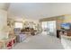 Cozy living room featuring comfortable seating and access to a sunroom at 5619 Bayshore Rd # 203, Palmetto, FL 34221