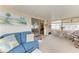 Bright sunroom with comfortable seating, sliding glass doors, and lots of natural light at 5619 Bayshore Rd # 203, Palmetto, FL 34221
