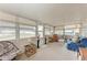 Bright sunroom with lots of windows, comfortable seating, and ample space for relaxation at 5619 Bayshore Rd # 203, Palmetto, FL 34221