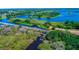 Aerial view of waterways and small islands showcasing lush surroundings at 5646 Simonton St, Bradenton, FL 34203