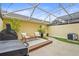 Enclosed backyard featuring a cozy seating area and well-manicured plants at 5646 Simonton St, Bradenton, FL 34203
