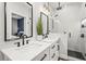 Sleek bathroom with a double vanity, modern fixtures, and a glass-enclosed shower at 5646 Simonton St, Bradenton, FL 34203