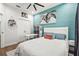 Cozy bedroom with horizontal blue accent wall, and modern decor at 5646 Simonton St, Bradenton, FL 34203