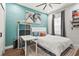 Bright bedroom with unique wall decor, comfortable furnishings, and a calming color scheme at 5646 Simonton St, Bradenton, FL 34203