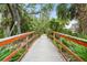 Community bridge showcasing lush green surroundings with inviting pathway at 5646 Simonton St, Bradenton, FL 34203