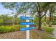 Directional community sign points to John's Island, Canoe Launch, and Observation Deck with a scenic waterfront backdrop at 5646 Simonton St, Bradenton, FL 34203
