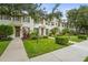 Charming townhome exteriors with lush landscaping and well-maintained sidewalks at 5646 Simonton St, Bradenton, FL 34203