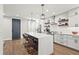 Bright kitchen with large island, pendant lights, and stainless steel appliances at 5646 Simonton St, Bradenton, FL 34203