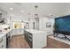 Spacious kitchen with white cabinets, large island, and office nook at 5646 Simonton St, Bradenton, FL 34203