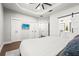 Airy main bedroom with tray ceiling and barn door access to the bathroom at 5646 Simonton St, Bradenton, FL 34203